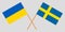 Sweden and Ukraine. Crossed Swedish and Ukrainian flags