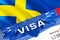 Sweden Visa in passport. USA immigration Visa for Sweden citizens focusing on word VISA. Travel Sweden visa in national