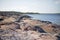 Swedish archipelago during summer. Cliffs, pebbles and distant islands
