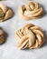 Swedish cinnamon buns dough on a parchment lined baking pan