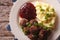 Swedish cuisine: meatballs, lingonberry sauce, potato closeup. H