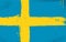 Swedish flag daubed with paint