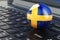 Swedish flag on laptop keyboard. Online business, education, shopping in Sweden concept. 3D rendering