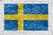 Swedish flag painted over white wall
