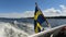 Swedish flag waving on rear of boat underway in Stockholm Archipelago. Side view video of flag on middle of boat rear deck