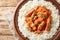 Swedish Korv Stroganoff is a classic dish that combines the comfort of a creamy tomato sauce with sausage with a side dish of rice
