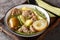 Swedish Lamb stew with fresh pears, potatoes, green beans close-up in a bowl. horizontal
