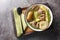 Swedish Lamb stew with fresh pears, potatoes, green beans close-up in a bowl. horizontal top view