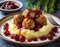 Swedish meatballs with mashed potatoes and red lingonberry sauce. Wooden table. Swedish cuisine