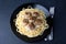 Swedish noisettes (fricandel) with spaghetti and Brune Sos creamy sauce. Traditional meatballs with garnish.
