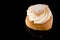 Swedish Semla isolated on black background with reflections, copy space