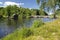 Swedish summer landscape with ancient bridge