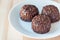 Swedish sweets Arrack balls, made from cookie crumbs, cocoa, butter and coconut wine Arrack flavour, on a wooden table, horizontal