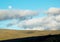 Sweeping Landscape of the Moonrise in a Cloudy Sky in the Ecuadorian Paramo