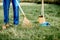 Sweeping leaves with orange rake