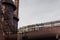 Sweeping tubes and columns of an industrial site, heavy rusted metal