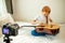 Sweet adorable child blogger play guitar