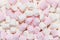 Sweet airy soft pastel pink and white marshmallows. Food background