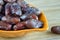 Sweet algerian arabic dates fruits on a plate