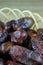 Sweet algerian arabic dates fruits on wooden basket