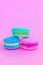 Sweet almond colorful unicorn blue green pink macaron or macaroon dessert cake isolated on trendy pink pastel background. French