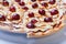 Sweet apple pizza with sliced grape on white background