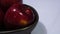 Sweet apple with stem leaf on bowl. Image fruit