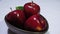 Sweet apple with stem leaf on bowl. Image fruit