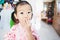 Sweet Asian little child surprise with round mouth and using hand cover her mouth