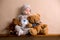 Sweet baby boy in bear overall, sleeping on a shelf with teddy b