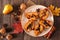 Sweet baked autumn pears, top view table scene over rustic wood