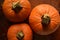 Sweet baking pumpkins on vintage leather suitcase