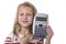 Sweet beautiful female child 6 to 8 years old holding calculator school supplies