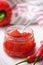 Sweet bell pepper and chili pepper sauce, confiture, jam in a glass jar.