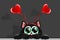 Sweet black cat with hair band and hearts on it. Valentine\\\'s day