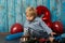 Sweet blond toddler child, boy, playing on his birhtday with toys and little chocolate cake