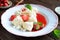 Sweet boiled dumplings filled with strawberries with a curd and a strawberry sauce