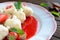 Sweet boiled dumplings filled with strawberries with a curd and a strawberry sauce