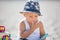 Sweet boys, celebrating on the beach birthday with car theme cake and decoration