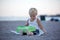 Sweet boys, celebrating on the beach birthday with car theme cake and decoration