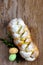 Sweet braided homemade bread with two easter eggs and twig with leaves