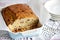 Sweet bread or pound cake with dried fruit, sliced in a baking dish