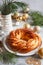 Sweet Bread Wreath decorated with stars cookies. Honey brioche garland with dried berries and nuts. Holiday recipes. Braided Bread