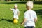 Sweet brothers playing active games in the garden