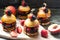 Sweet burgers with brioche bun, chocolate brownie layer, fresh strawberries and chocolate sauce