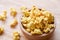 Sweet butter popcorn in bowl on wooden