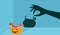 Sweet candy lollipop dessert in cute orange pumpkin basket with spooky evil devil monster hand shadow onto blue wall. Decoration