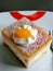 Sweet cheescake with cream and fruits  on a plate