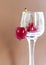 Sweet cherries. Red cherries hang on a transparent glass. Ripe berry.