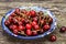 Sweet cherry in oriental ceramic bowl on rusty backdrop